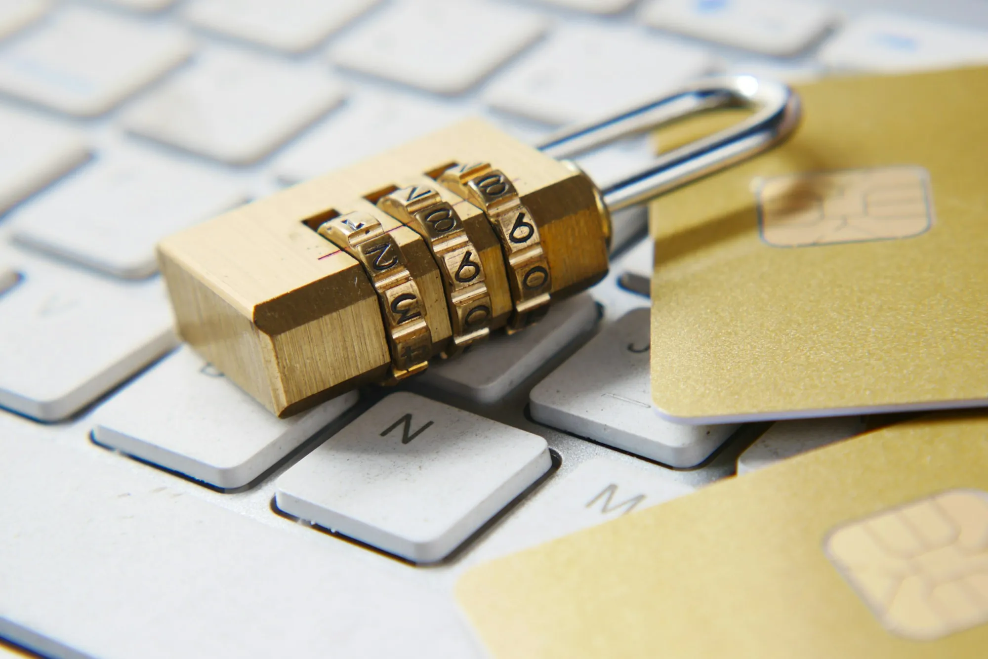Privacy Policy Golden padlock resting on a computer keyboard