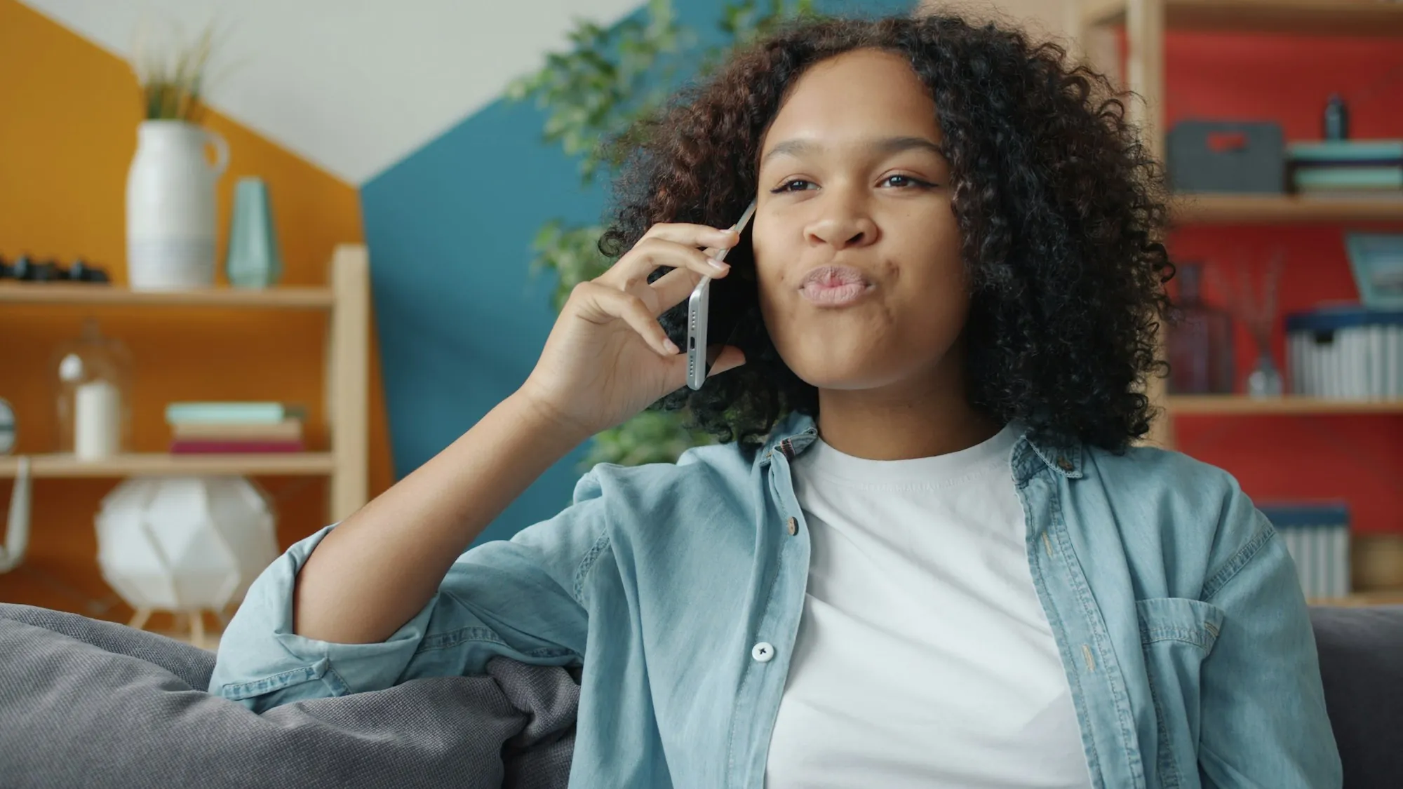 Contact Lake Forest Water Pros Young woman talking on a mobile phone on the sofa at home